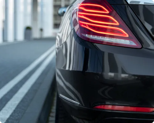 An image showing the tail light of a luxury car