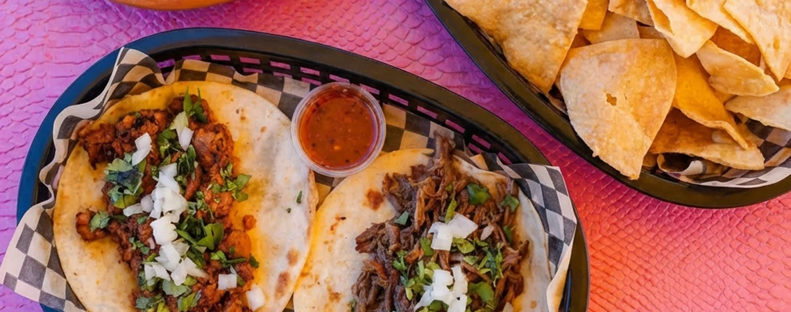 Appetizing images of beef tacos topped with onions and cilantro alongside crispy nachos served with salsa, accompanied by text recommending local eateries, ideal for busy executives, visitors, or event-goers arriving via car service in White Plains.