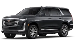 Tilted front and side view of Cadillac Escalade limo SUV under NYC United limo.