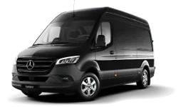 Tilted front and side view of Mercedes Benz Sprinter under NYC United limo.