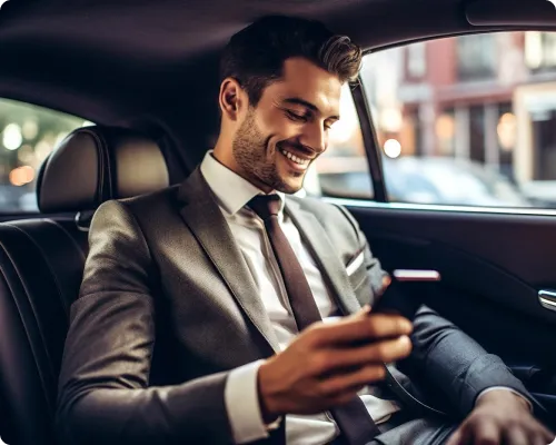 A business executive is traveling back to the airport in NYC Unitel limo after having a successful client meeting in Brookville.